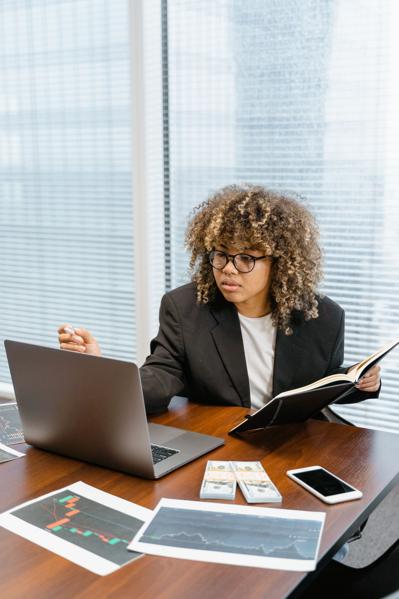 Financial advisor studying reports in a modern California office