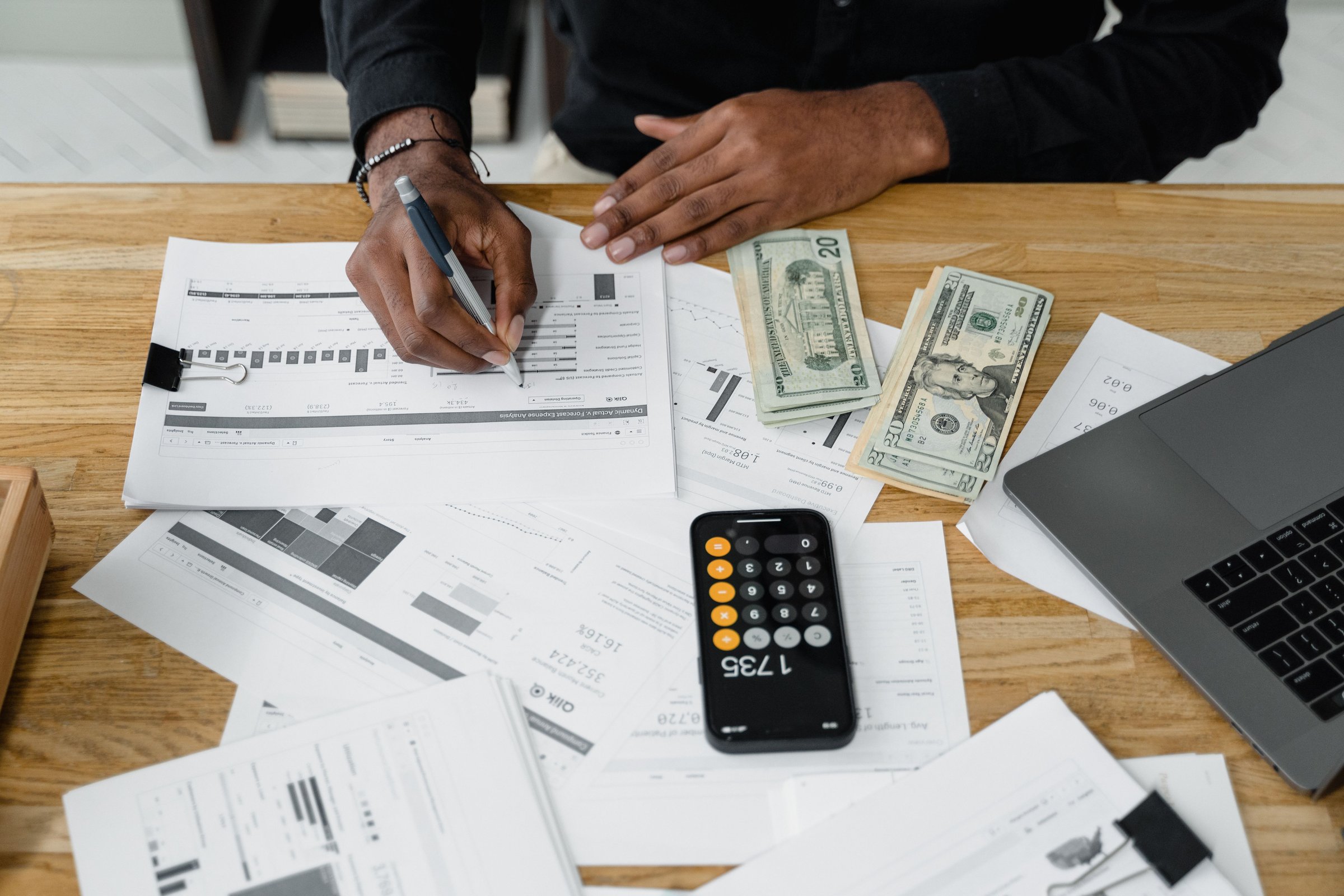Accounting workspace with organized reports and a calculator